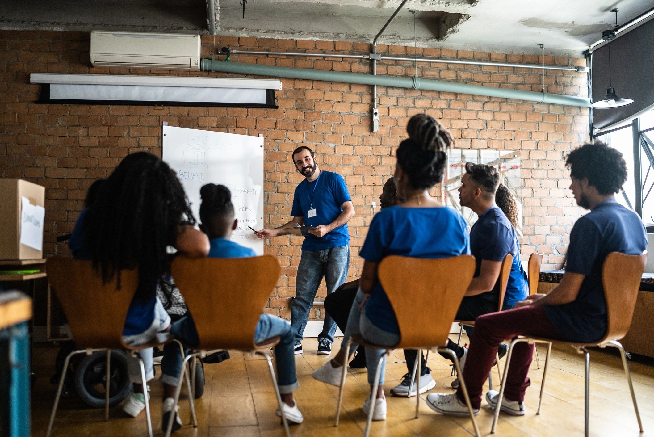 Volunteers meeting in a community center