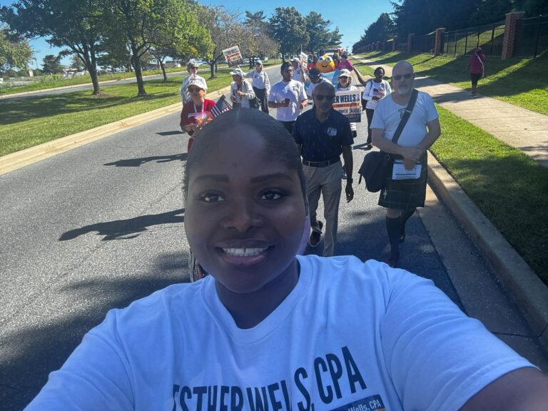Esther Wells with campaign volunteers at an outdoor event