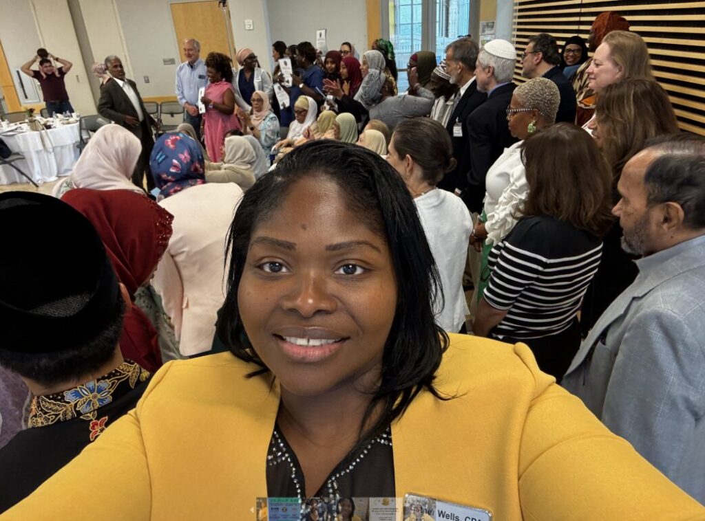 Esther Wells among residents at a community event