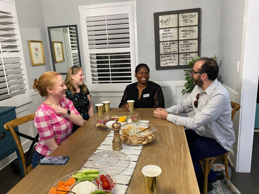Esther Wells meeting county residents around a table